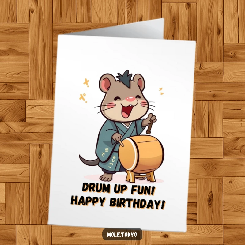 Funny Free Printable Birthday Card with a stylized mole in a formal kimono enthusiastically playing a large taiko drum with great energy.